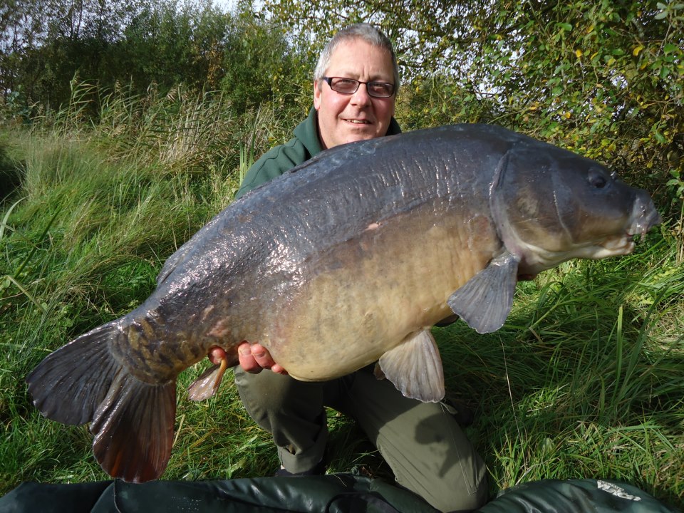 Simon Cooper with a lovely dark looking carp